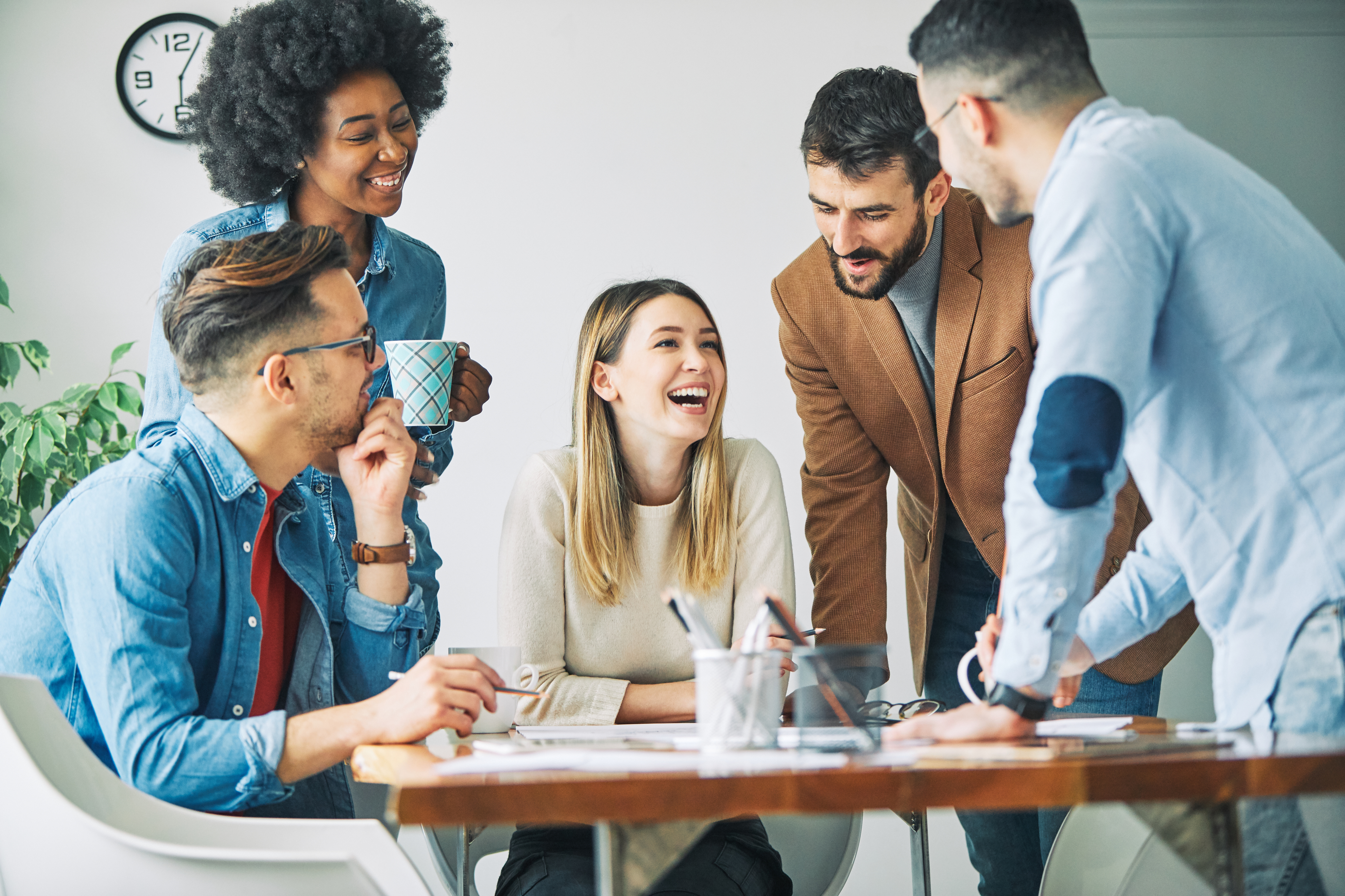 Coworkers collaborating around a desk