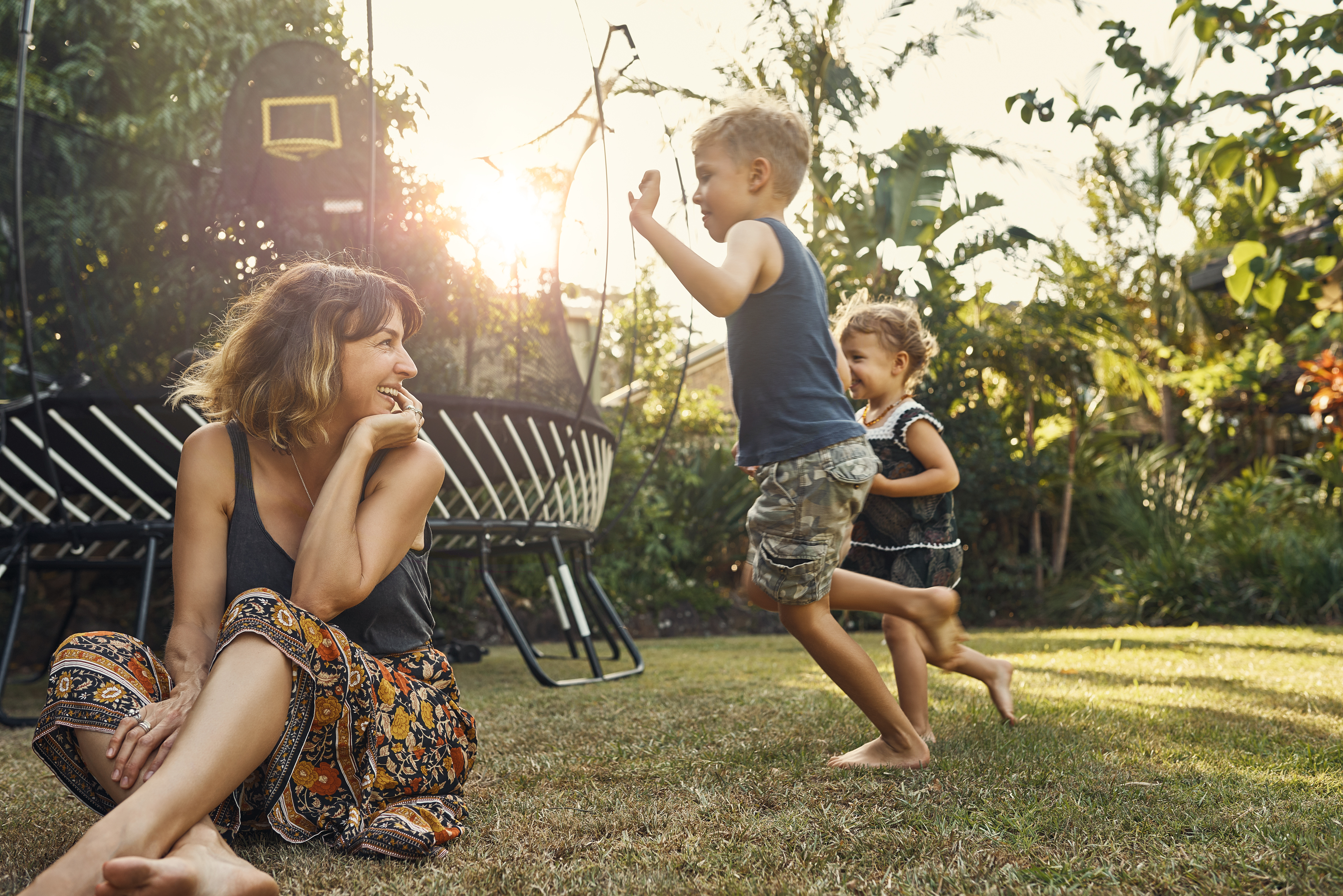 Mum and kids playing in the garden